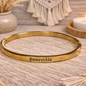 0-02-05-71dc7d428e3f2df2aa7dc5c4146d5a98c9b933dd0aec44097c78853bac70eaec_9d4f677431d8d4c0 Ατσάλινη χειροπέδα σε χρυσή απόχρωση, με χαραγμένο το όνομα ΕΥΑΓΓΕΛΙΑ.