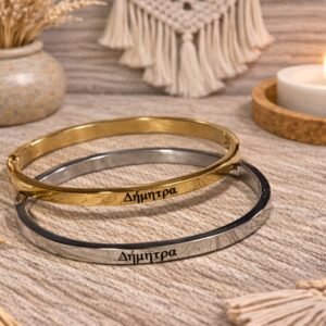 0-02-05-d528cf0a1c32c14a3bb13973d7617912ee0641fe7b0ebe95b30aa1f06e731ae5_fd7348c97400e60b Ατσάλινη χειροπέδα σε ασημί απόχρωση, με χαραγμένο το όνομα ΔΗΜΗΤΡΑ.