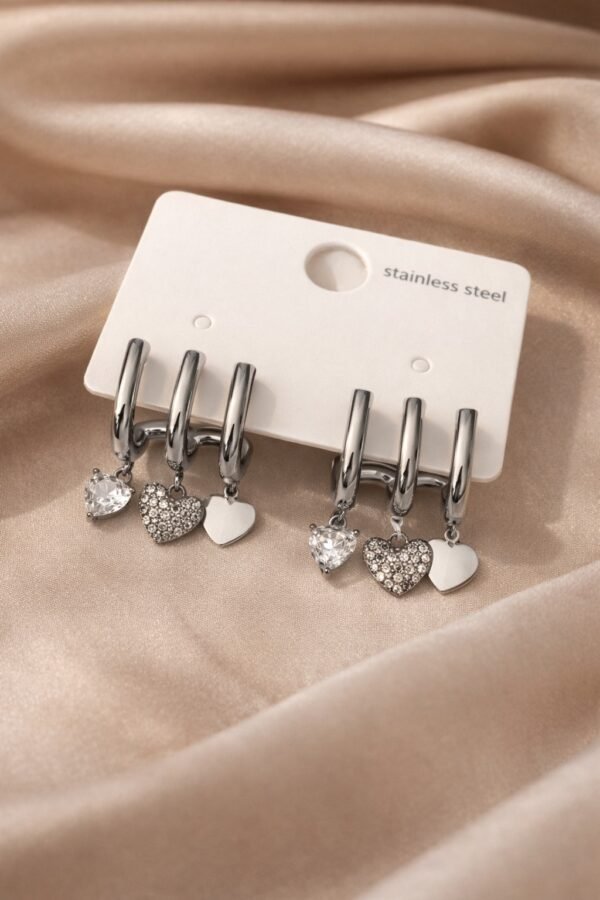 Σκουλαρίκι τριπλό ασημί.